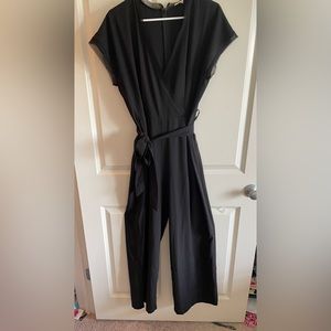 Black women’s boutique jumpsuit, size medium, fits medium/large. Worn once